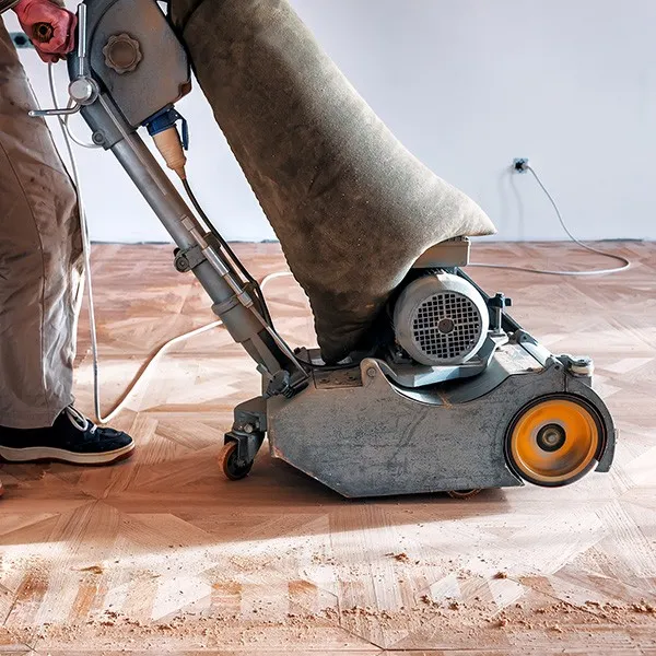 Hardwood floor planks being resurfaced